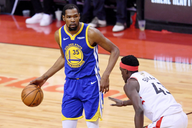 Golden State Warriors forward Kevin Durant (35) dribbles in front of Toronto Raptors forward Pascal Siakam (43) during the second quarter in game five of the 2019 NBA Finals at Scotiabank Arena on Jun 10, 2019 in Toronto, Canada. [Photo: IC]