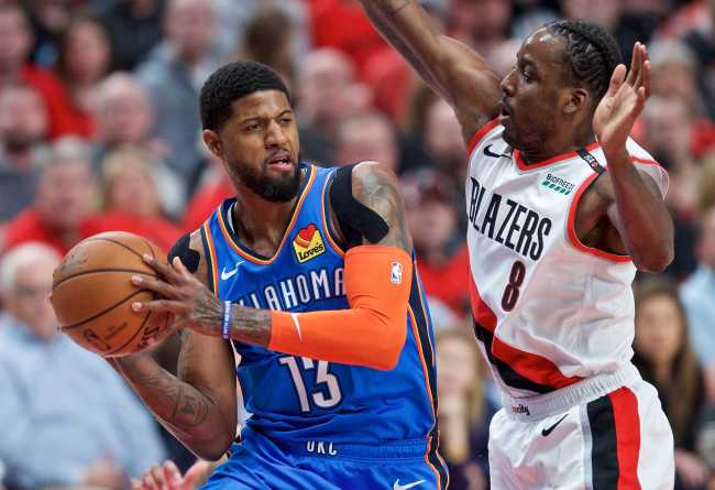 In this April 16, 2019, file photo, Oklahoma City Thunder forward Paul George (L) looks to pass the ball around Portland Trail Blazers forward Al-Farouq Aminu during the first half of Game 2 of an NBA basketball first-round playoff series in Portland, Oregon, U.S. [Photo: IC]