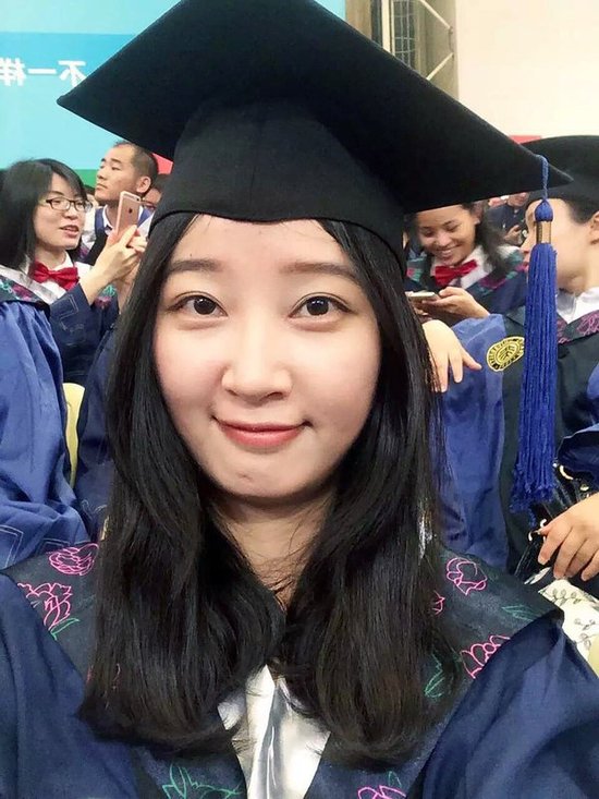 FILE - This 2016 selfie provided by her family shows Yingying Zhang in a cap and gown for her graduate degree in environmental engineering from Peking University Shenzhen Graduate School. Jurors on Monday, June 24, 2019, in Peoria, Ill., have convicted Brendt Christensen, a former University of Illinois doctoral student in the slaying of Zhang, who was abducted at a bus stop as she headed to sign an off-campus apartment lease. Zhang's body has not been found. [Photo: Zhang Family]