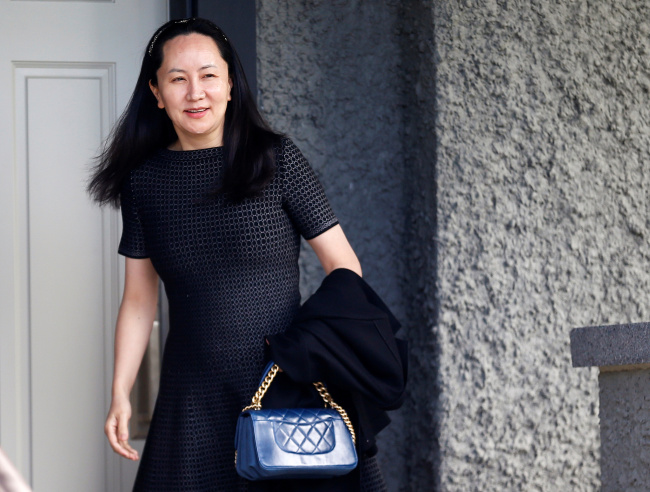 Huawei's Financial Chief Meng Wanzhou leaves her family home in Vancouver, British Columbia, Canada, May 8, 2019. [File Photo: VCG/Reuters/Lindsey Wasson]