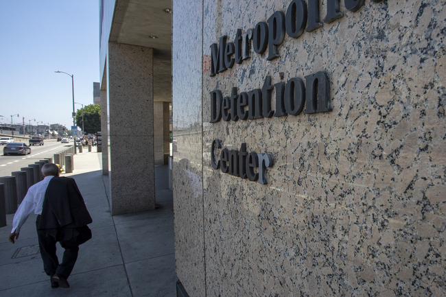 A pedestrian passes the Metropolitan Detention Center prison as mass arrests by federal immigration authorities, as ordered by the Trump administration, were supposed to begin in major cities across the nation on July 14, 2019 in Los Angeles, California. [Photo: VCG]