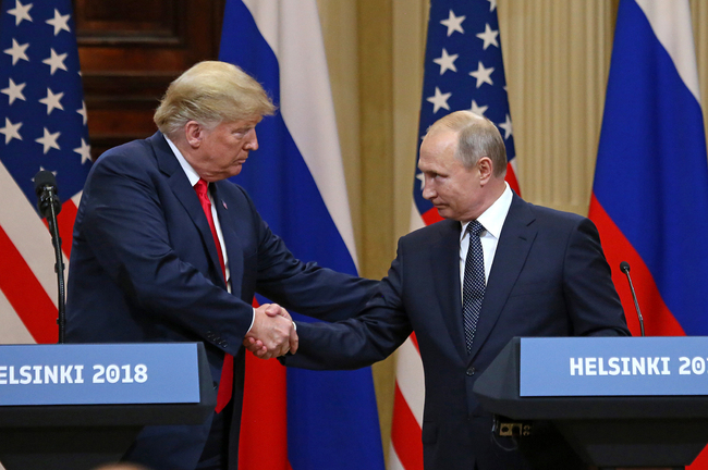 U.S. President Donald Trump (L) shakes hands with Russian President Vladimir Putin during a joint press conference at the Presidential Palace in Helsinki, Finland, on July 16, 2018. [File photo: IC]