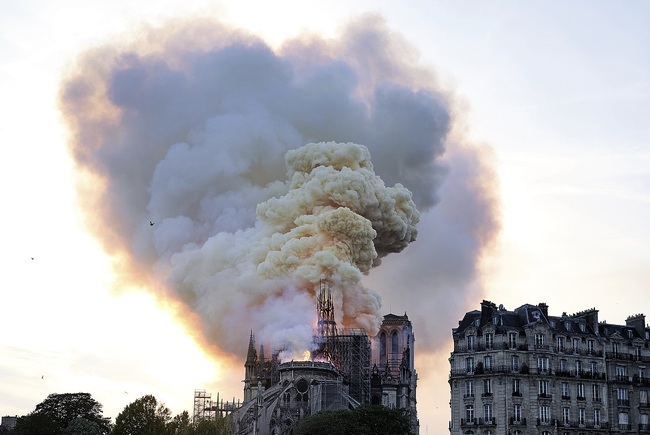 Flames and smoke rise as the spire on Notre Dame cathedral collapses in Paris, Monday, April 15, 2019. [Photo: AP]