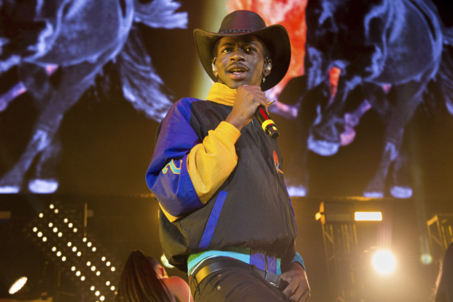 This June 1, 2019 file photo shows Lil Nas X performing at HOT 97 Summer Jam 2019 in East Rutherford, N.J. The rapper has taken his "Old Town Road" to the top of the Billboard charts for 16 weeks, tying a record set by Mariah Carey and Luis Fonsi. [Photo: AP/Scott Roth/Invision]