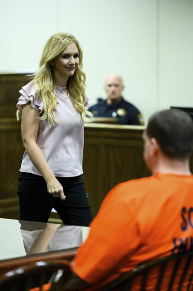 Melissa Brackman, widow of Scott Ponder, looks at Todd Kohlhepp after giving her testimony at a damages hearing at the Spartanburg County Courthouse Friday, July 26, 2019 in Spartanburg, S.C. Kohlhepp confessed to killing Brackman's then-husband Scott Ponder, as well as Beverly Guy, Brian Lucas and Chris Sherbert, 13 years after he shot the four at Superbike Motorsports in Chesnee on Nov. 6, 2003. [Photo: Josh Morgan/The Independent-Mail via AP]