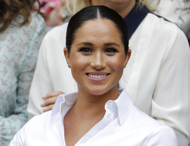 In this July 13, 2019 file photo, Kate, Meghan, Duchess of Sussex smiles while sitting in the Royal Box on Centre Court to watch the women's singles final match between Serena Williams, of the United States, and Romania's Simona Halep on at the Wimbledon Tennis Championships in London. [File photo: AP] 