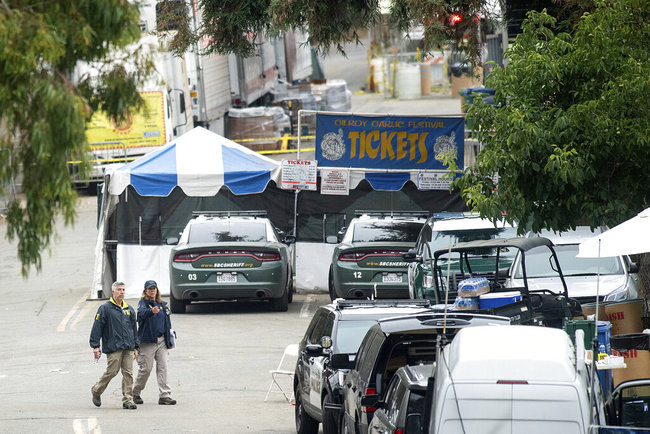 FBI personnel pass a ticket booth at the Gilroy Garlic Festival Monday, July 29, 2019 in Calif., the morning after a gunman killed at least three people, including a 6-year-old boy, and wounding about 15 others. [Photo: AP]