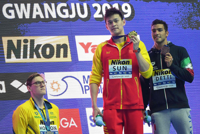 Silver medalist Australia's Mack Horton (L) refuses to stand on the podium with gold medalist China's Sun Yang (C) and bronze medalist Italy's Gabriele Detti after the final of the men's 400m freestyle event during the swimming competition at the 2019 World Championships at Nambu University Municipal Aquatics Center in Gwangju, South Korea, on July 21, 2019. [Photo: VCG/Manan Vatsyayana]