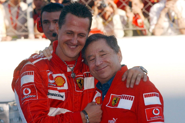Michael Schumacher (L) and then Ferrari team boss Jean Todt [File photo: IC]