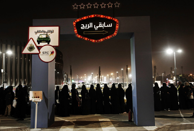 In this June 22, 2018, file photo, women wait in line to ride go carts at a road safety event for female drivers launched at the Riyadh Park Mall in Riyadh. Saudi Arabia has issued new laws that grant women greater freedoms by allowing any citizen to apply for a passport and travel freely, ending a long-standing and controversial guardianship policy that had required male consent for a woman to travel or carry a passport. [Photo: AP /Nariman El-Mofty]