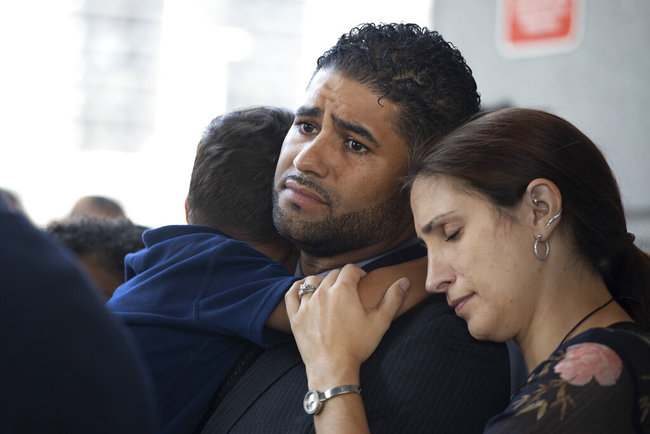 Juan Rodriguez, holding his son Tristan, leaves Bronx Criminal Court with his wife Marissa after a hearing, Thursday, Aug. 1, 2019 in New York. [Photo: AP]