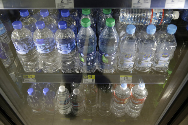 Plastic bottles of water are seen for sale at a store Friday, Aug. 2, 2019, in San Francisco. San Francisco International Airport is banning the sale of single-use plastic water bottles. The unprecedented move at one of the major airports in the country will take effect Aug. 20, the San Francisco Chronicle reported Friday. The new rule will apply to airport restaurants, cafes and vending machines. Travelers who need plain water will have to buy refillable aluminum or glass bottles if they don't bring their own. [Photo: AP/Eric Risberg]