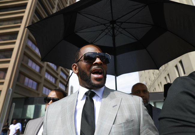 In this June 6, 2019, file photo, musician R. Kelly leaves the Leighton Criminal Court building in Chicago. Minnesota authorities charged singer R. Kelly on Monday, Aug. 5, 2019, with two counts of prostitution and solicitation involving a girl under 18 in 2001. [File photo: AP]