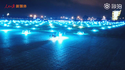 A scene from a video released by People's Daily shows drones taking to the air to present a light show in the sky at Shenzhen Bay in Guangdong Province, on Sunday, August 11, 2019. [Photo: China Plus]