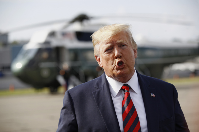 U.S. President Donald Trump speaks with reporters before boarding Air Force One at Morristown Municipal Airport in Morristown, New Jersey, the United States, on August 18, 2019. [Photo: AP via IC]