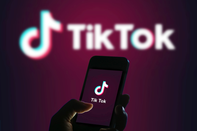 The logo for Tik Tok on a mobile phone. [File Photo: IC]