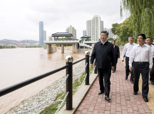 Chinese President Xi Jinping, also general secretary of the Communist Party of China Central Committee and chairman of the Central Military Commission, visits a Yellow River management point to learn about the management, protection and flood control project construction of the Yellow River in Lanzhou, Gansu Province, Aug. 21, 2019. [Photo: Xinhua/Wang Ye]