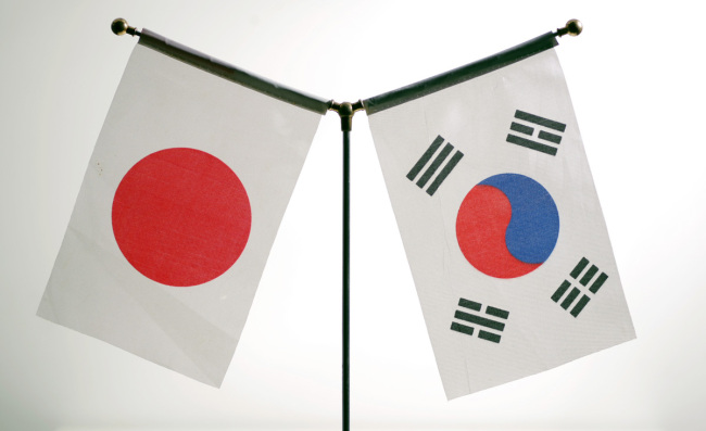 National flags of Japan and South Korea. [File Photo: IC]