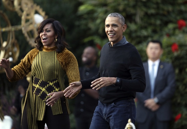 In this Oct. 31, 2016 file photo, President Barack Obama and the first lady Michelle Obama dance with kids to the beat of "Thriller" during a Halloween celebration at the South Portico of the White House in Washington. [Photo: AP]