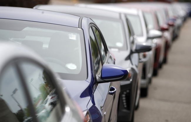 In this May 19, 2019, file photograph, a long line of unsold 2019 sedans sits at a dealership in Littleton, Colorado. [Photo: AP/David Zalubowski]