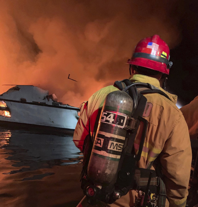 In this photo provided by the Ventura County Fire Department, VCFD firefighters respond to a boat fire off the coast of southern California, Monday, September 2, 2019. [Photo: Ventura County Fire Department via AP]