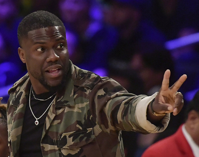 In this Jan. 29, 2019, file photo, actor Kevin Hart gestures during the second half of an NBA basketball game between the Los Angeles Lakers and the Philadelphia 76ers in Los Angeles. Hart has been injured in a car crash in the hills above Malibu on Sunday, Sept. 1. [Photo: AP/Mark J. Terrill]