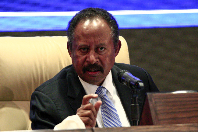 Sudan's new Prime Minister Abdalla Hamdok flashes the victory gesture during a press conference unveiling the first cabinet in the capital Khartoum on September 5, 2019. [Photo: AFP/Ebrahim HAMID]