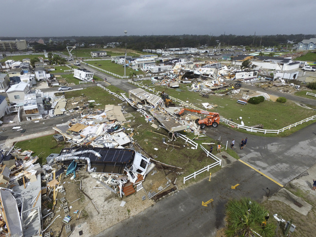 Emerald Isle town employees work to clear the road after a tornado hit Emerald Isle N.C. as Hurricane Dorian moved up the East coast on Thursday, Sept. 5, 2019. [Photo: AP /Tom Copeland]