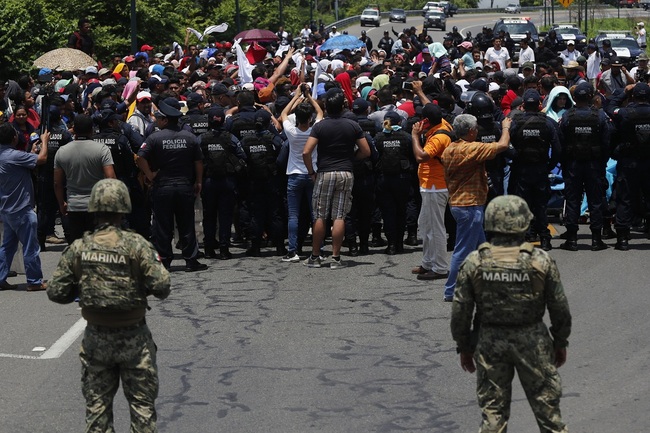 File Photo: Mexican authorities stop a migrant caravan that had earlier crossed the Mexico - Guatemala border, near Metapa, Chiapas state, Mexico, on June 5, 2019. [Photo: AP/Marco Ugarte]