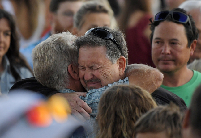 Glen Fritzler, left, co-owner of Truth Aquatics and the dive boat Conception, consoles an attendee during a vigil Friday, Sept. 6, 2019, in Santa Barbara, Calif., for the victims who died aboard the dive boat Conception. [Photo: AP]