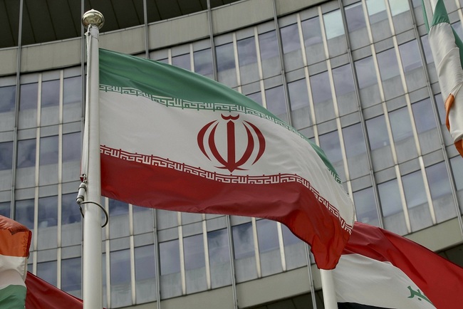 The Iranian flag waves outside of the UN building that hosts the International Atomic Energy Agency, IAEA, office inside in Vienna, Austria, Wednesday, July 10, 2019. [File Photo: AP via IC/Ronald Zak]