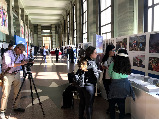 Visitors at the exhibition "Pursuing Happiness for the People: China's 70 years of human rights achievements on display" in Geneva, Switzerland, on Monday, September 9, 2019. [Photo: China Plus]