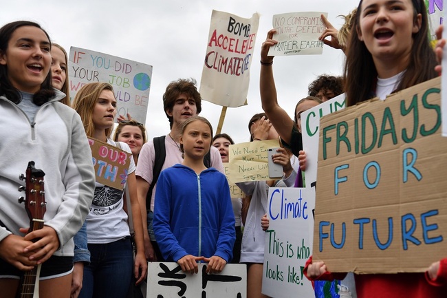 Swedish environment activist Greta Thunberg (C), 16, takes part in a climate protest outside the White House in Washington on September 13, 2019. [Photo: AFP/Nicholas Kamm]