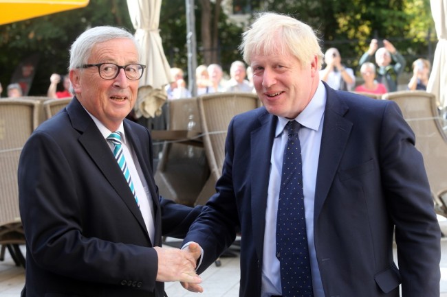 EU Commission President Jean-Claude Juncker (L) shakes hands with British Prime Minister Boris Johnson prior to their meeting on September 16, 2019 in Luxembourg. [Photo: AFP]