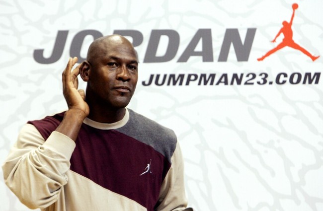 Michael Jordan speaks to young basketball players as he is in Milan to promote a new clothing line on October 24, 2006. [Photo: AFP]