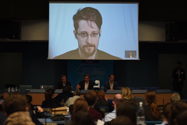 Former US National Security Agency (NSA) contractor and whistle blower Edward Snowden speaks via video link from Russia as he takes part in a round table meeting on the subject of "Improving the protection of whistleblowers" on March 15, 2019, at the Council of Europe in Strasbourg, eastern France. [File photo: AFP/Frederick Florin]