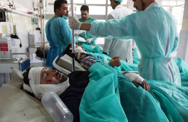 Wounded Afghan men receive treatment at the Wazir Akbar Khan hospital following a blast in Kabul on September 17, 2019. [Photo: AFP]