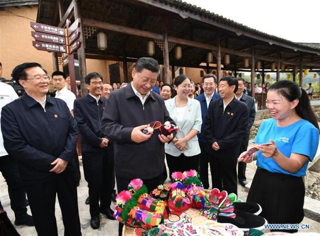 Chinese President Xi Jinping, also general secretary of the Communist Party of China Central Committee and chairman of the Central Military Commission, learns about building the town of Chuangke, or makers, and promoting rural tourism and rural revitalization by red tourism resources at Tianpudawan in Tianpu Township of Xinxian County, central China's Henan Province, Sept. 16, 2019. [Photo: Xinhua]