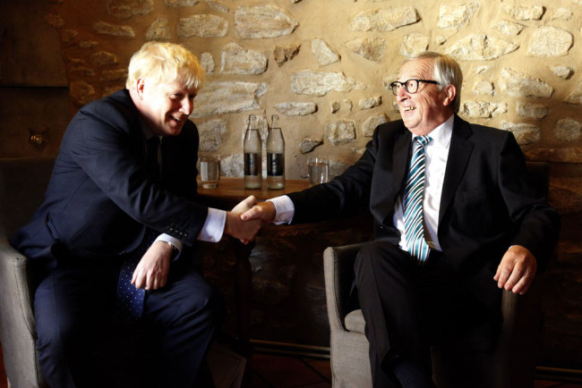 EU Commission president Jean-Claude Juncker (R) shakes hands with British Prime Minister Boris Johnson (L) prior to their meeting, on September 16, 2019 in Luxembourg. [Photo: AFP/François Walschaerts]