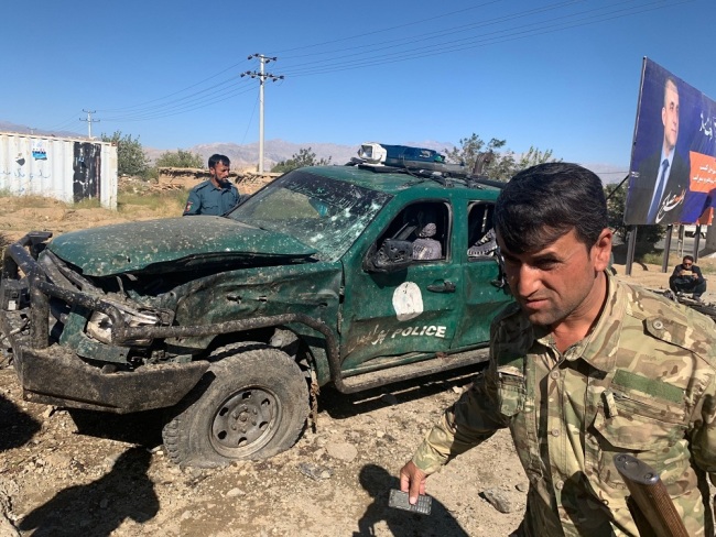 Afghan police inspect the site of a suicide attack, in Parwan province of Afghanistan, Tuesday, Sept. 17, 2019. The Taliban suicide bomber on a motorcycle targeted a campaign rally by President Ashraf Ghani in northern Afghanistan on Tuesday, killing at over 20 people and wounding over 30. [Photo: AP via IC/Rahmat Gul]