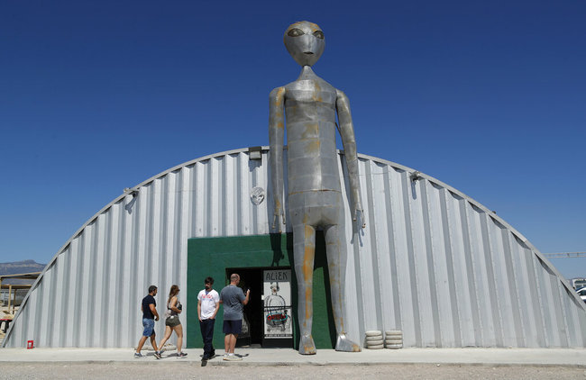 People enter and exit the Alien Research Center in Hiko, Nev. No one knows what to expect, but lots of people are preparing for "Storm Area 51" on Wednesday, Sept. 18, 2019, in the Nevada desert. [Photo: AP]