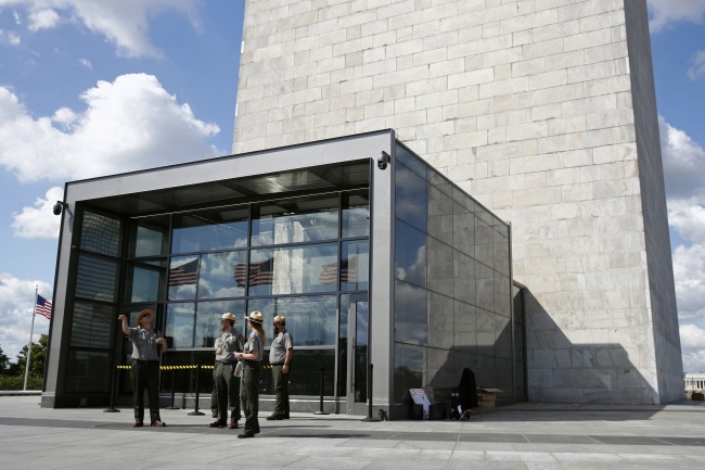 National Parks Service park rangers gather outside a new security screening building at the foot of the Washington Monument during a preview tour ahead of the monument's official reopening, Wednesday, Sept. 18, 2019, in Washington. [Photo: AP]