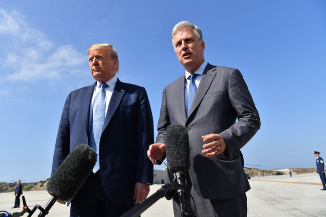 US President Donald Trump (L) speaks next to new national security advisor Robert O'Brien on September 18, 2019 at Los Angeles International Airport in Los Angeles, California. [Photo: AFP/Nicholas Kamm]