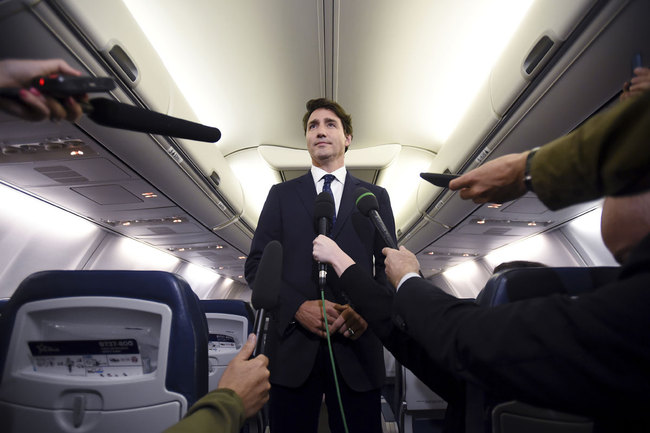 Canadian Prime Minister and Liberal Party leader Justin Trudeau makes a statement in regards to a photo coming to light of himself from 2001, wearing "brownface," during a scrum on his campaign plane in Halifax, Nova Scotia, Wednesday, Sept. 18, 2019. [Photo: AP]