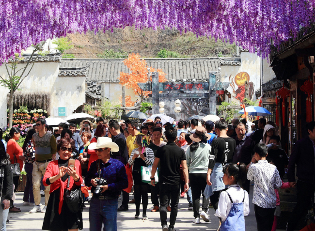 Tourists visit an ancient town in Shangrao, Jiangxi Province, May 3, 2019. [Photo: VCG]