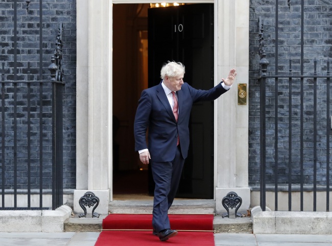 Britain's Prime Minister Boris Johnson waves to welcome the Emir of Qatar, Sheikh Tamim bin Hamad Al Thani at 10 Downing Street in London, Friday, Sept. 20, 2019 for bilateral talks. [Photo: AP]