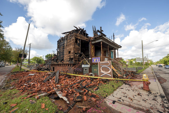 The "You" house at the Heidelberg Project in Detroit stands badly damaged after a fire early Monday, September 23, 2019.[Photo:AP]