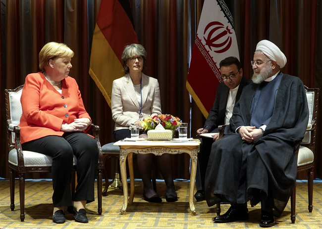 A handout picture provided by the office of Iranian President Hassan Rouhani on September 24, 2019 shows him meeting with German Chancellor Angela Merkel (L) on the sidelines of the 74th United Nations General Assembly in New York. [Photo: HO/Iranian Presidency/AFP]