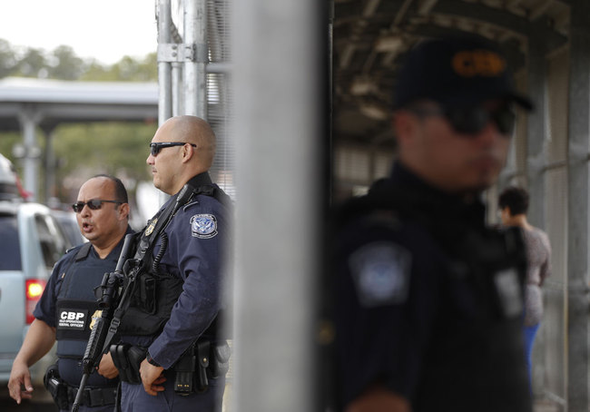 Customs and Border Protection agents monitor cars, left, and pedestrians enter the U.S. through a walkway, at the Puerta Mexico international bridge in Matamoros, Tamaulipas state, Mexico, Friday, June 28, 2019. [Photo: AP]