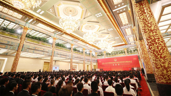 A presentation ceremony for national medals and honorary titles is held on September 29, 2019, at the Great Hall of the People in Beijing. [Photo: Xinhua]